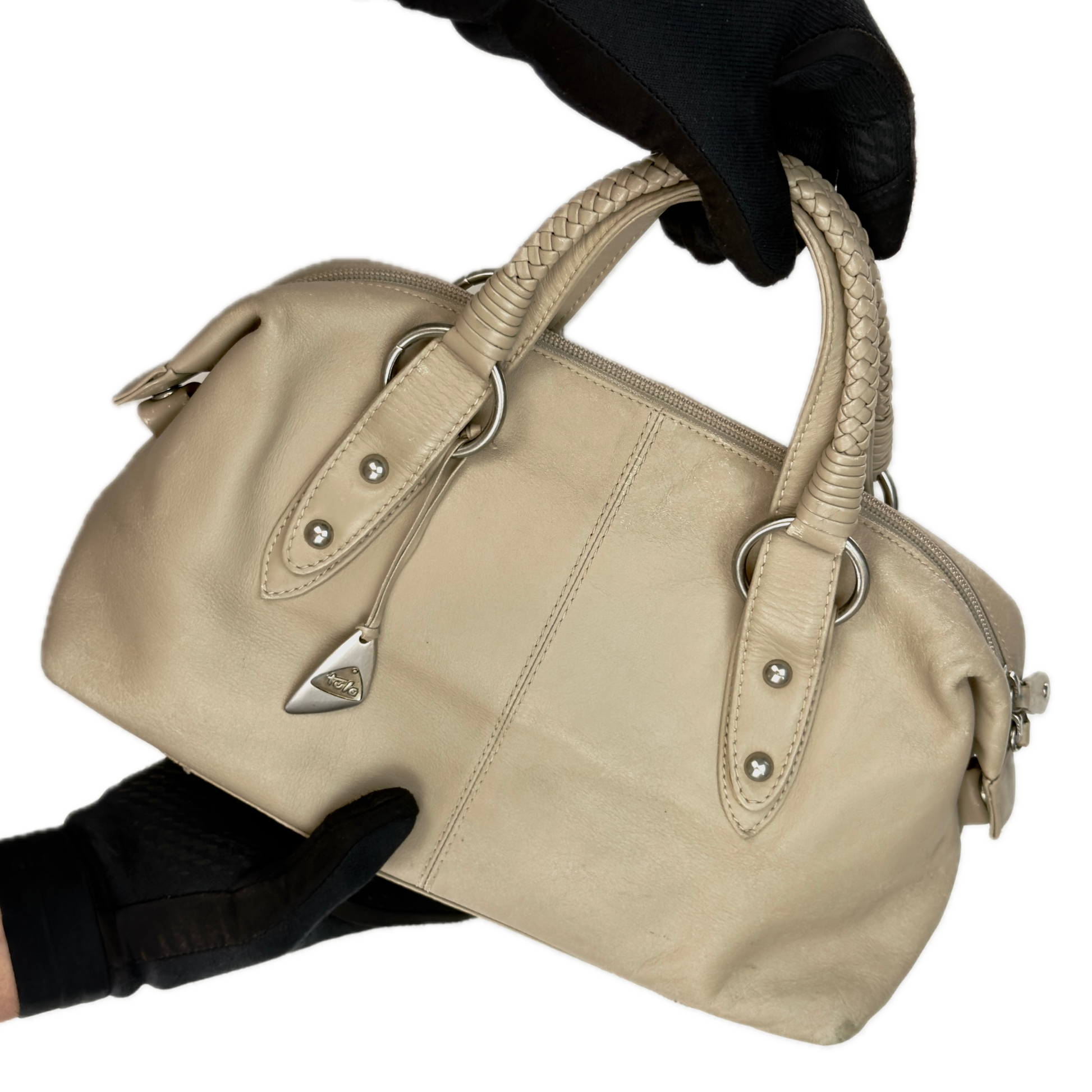 Front view of a structured vintage Y2K Tula cool beige genuine leather top handle bag with silver hardware.