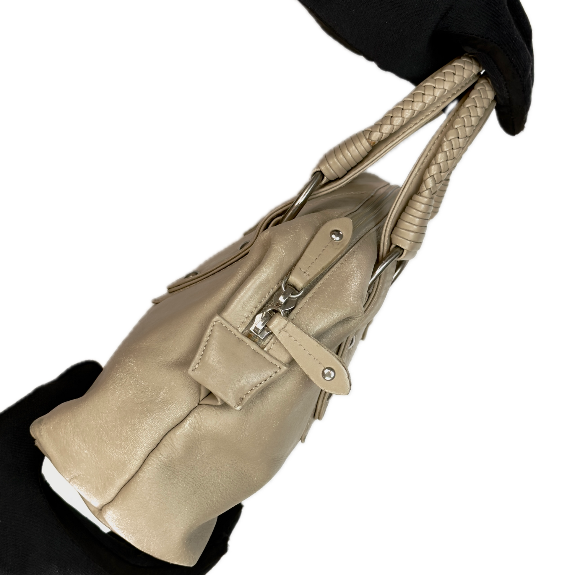 Side view of a structured vintage Y2K Tula cool beige genuine leather top handle bag with silver hardware.