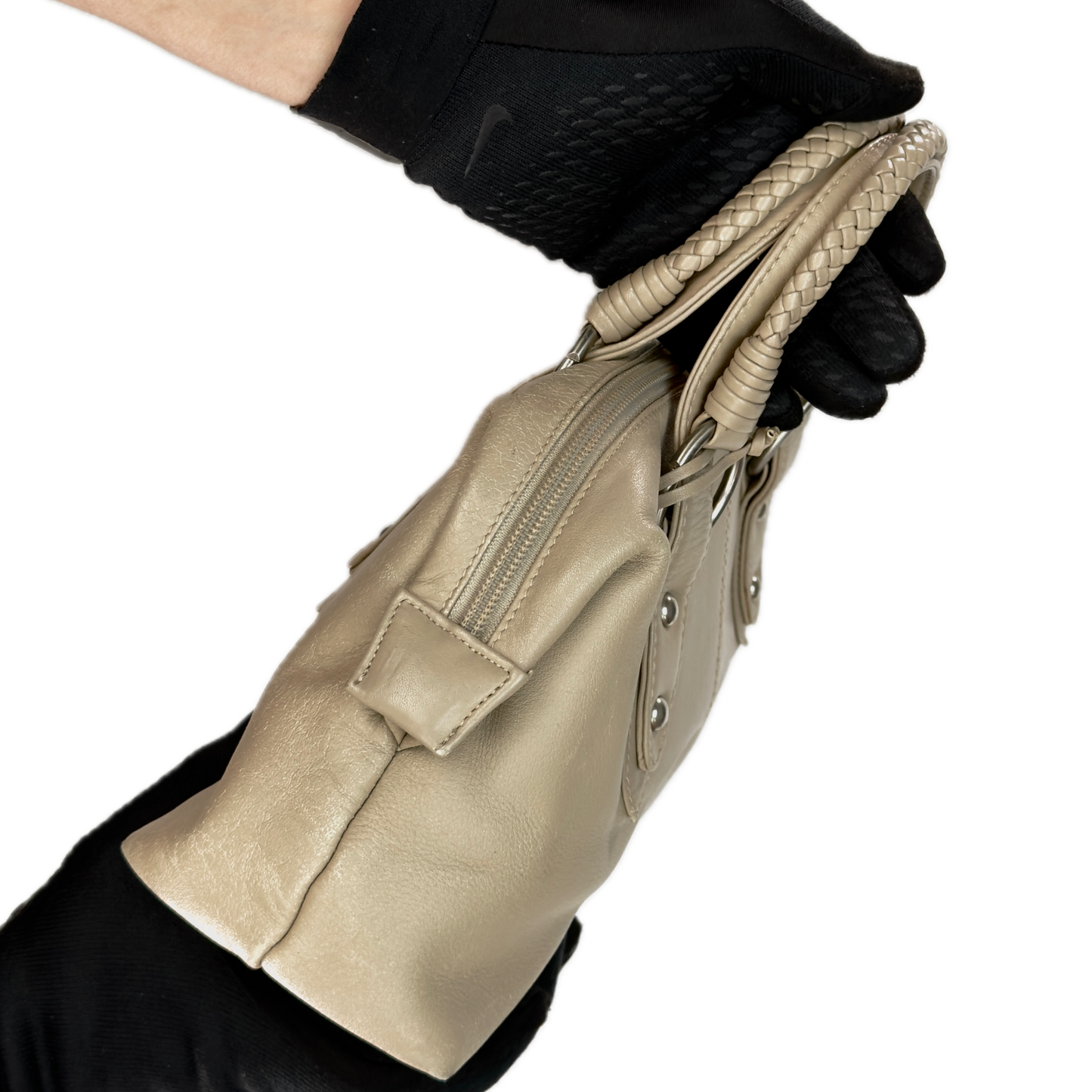 Side view of a structured vintage Y2K Tula cool beige genuine leather top handle bag with silver hardware.