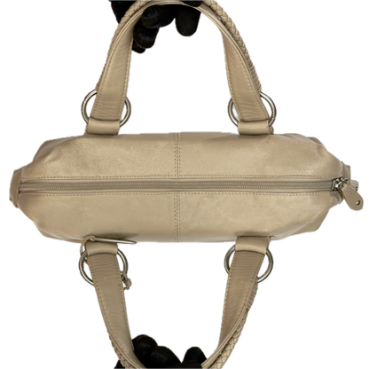 Aerial view of a structured vintage Y2K Tula cool beige genuine leather top handle bag with silver hardware.