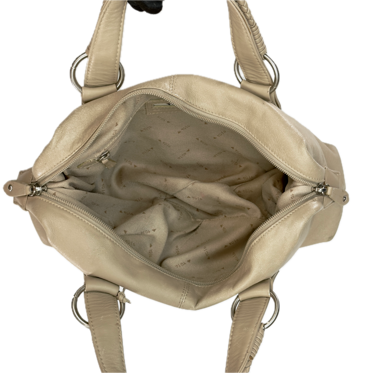 A Tula beige leather handbag shown open from a top-down view, displaying its interior lining and silver-tone metal hardware against a plain white background.