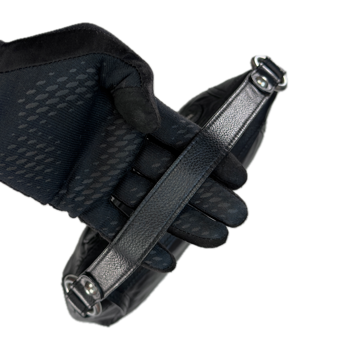 Handle of a slouchy vintage Y2K unbranded black genuine leather baguette shoulder bag featuring a front zip pocket and silver hardware.