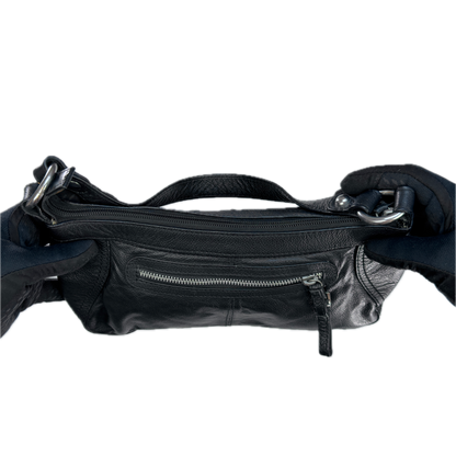 Aerial view of a slouchy vintage Y2K unbranded black genuine leather baguette shoulder bag featuring a front zip pocket and silver hardware.