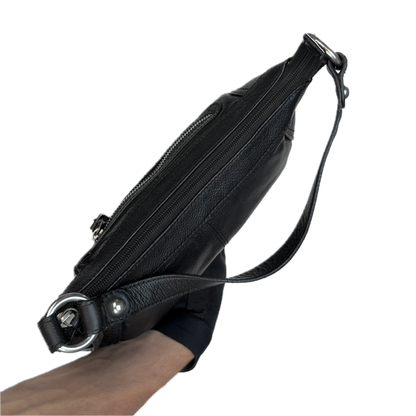Aerial view of a slouchy vintage Y2K unbranded black genuine leather baguette shoulder bag featuring a front zip pocket and silver hardware.