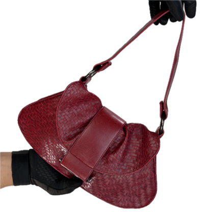 Front view of a vintage Y2K Wallis red woven faux leather baguette shoulder bag featuring gunmetal hardware and a smooth center flap.