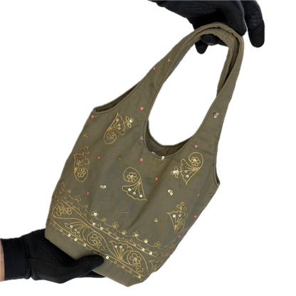 Front view of a slouchy vintage Y2K Warehouse khaki sequin cotton bucket bag.
