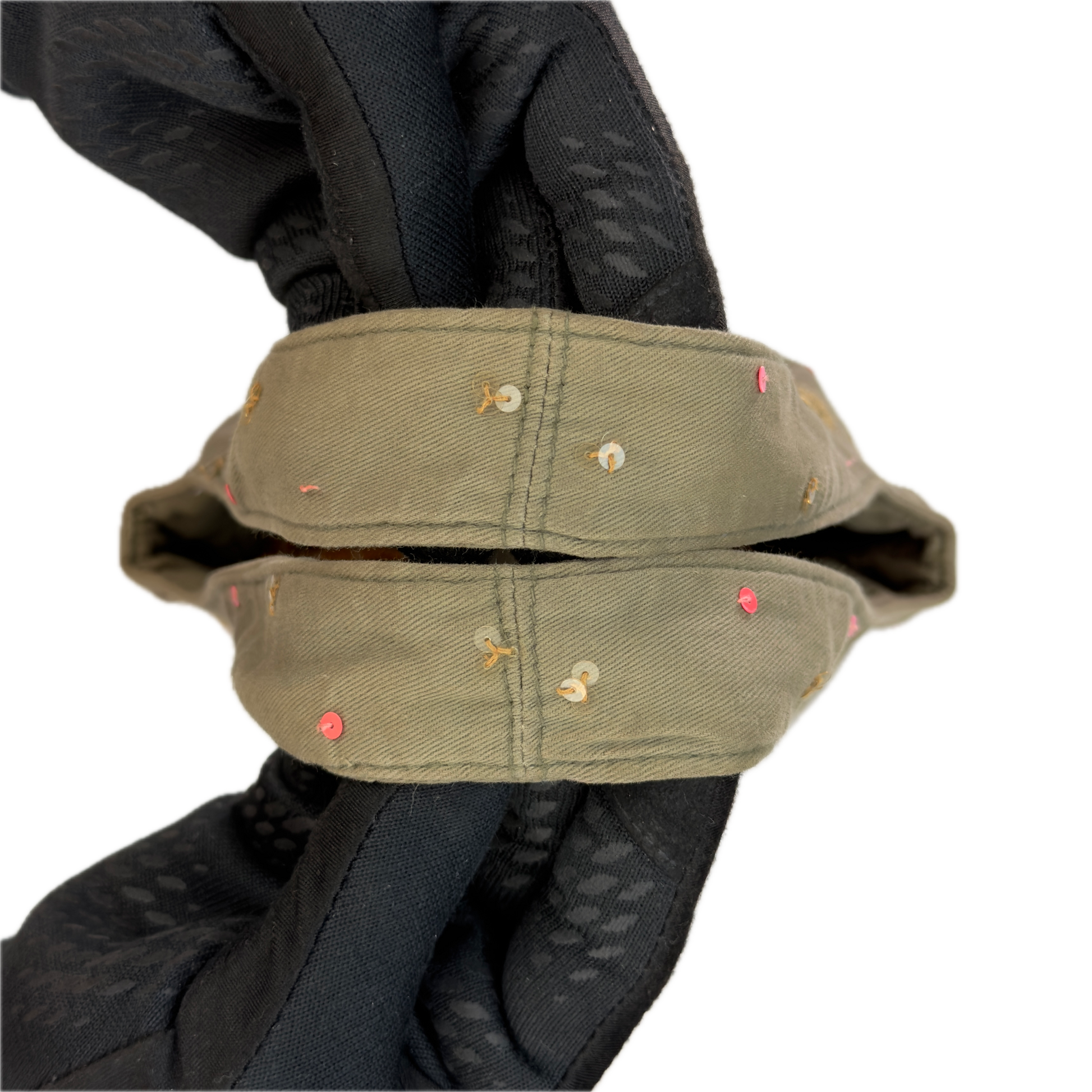 Handles of a slouchy vintage Y2K Warehouse khaki sequin cotton bucket bag.