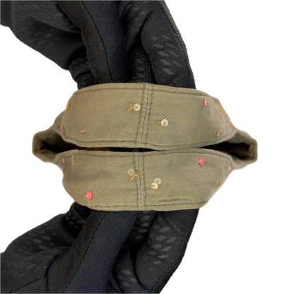 Handles of a slouchy vintage Y2K Warehouse khaki sequin cotton bucket bag.