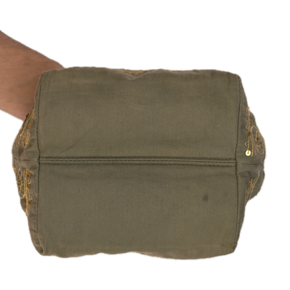 Bottom view of a slouchy vintage Y2K Warehouse khaki sequin cotton bucket bag.