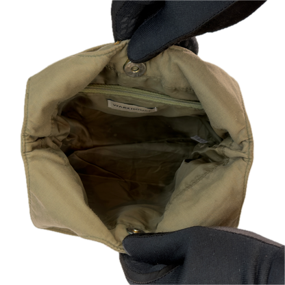 Top-down interior view of an open vintage khaki sequin bucket bag.