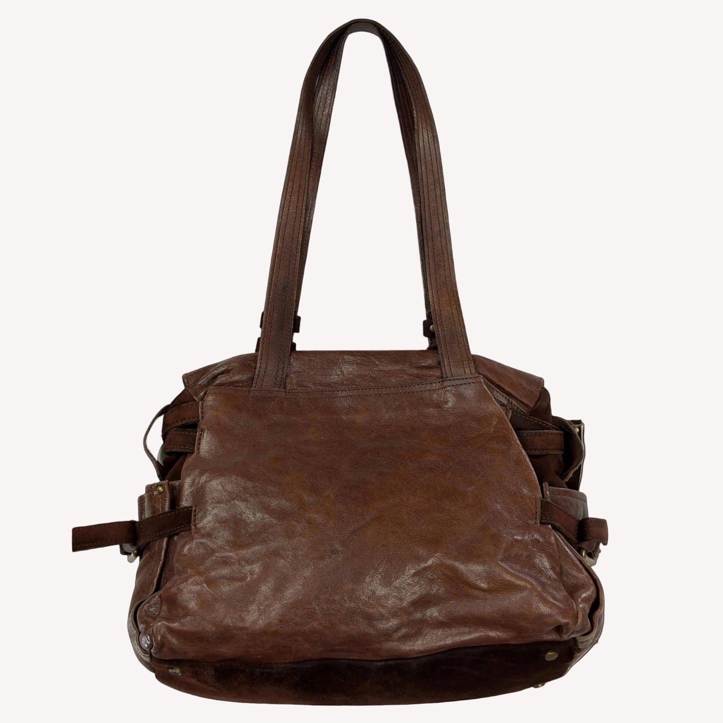 Vintage Zippo slouchy shoulder bag crafted from distressed brown crinkled leather, featuring a sturdy suede base and utilitarian antique brass hardware.