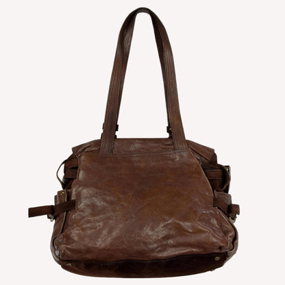 Vintage Zippo slouchy shoulder bag crafted from distressed brown crinkled leather, featuring a sturdy suede base and utilitarian antique brass hardware.