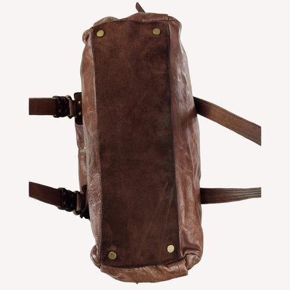 Close-up of the antique brass utilitarian hardware and distressed brown leather on a rare vintage Zippo archive bag.